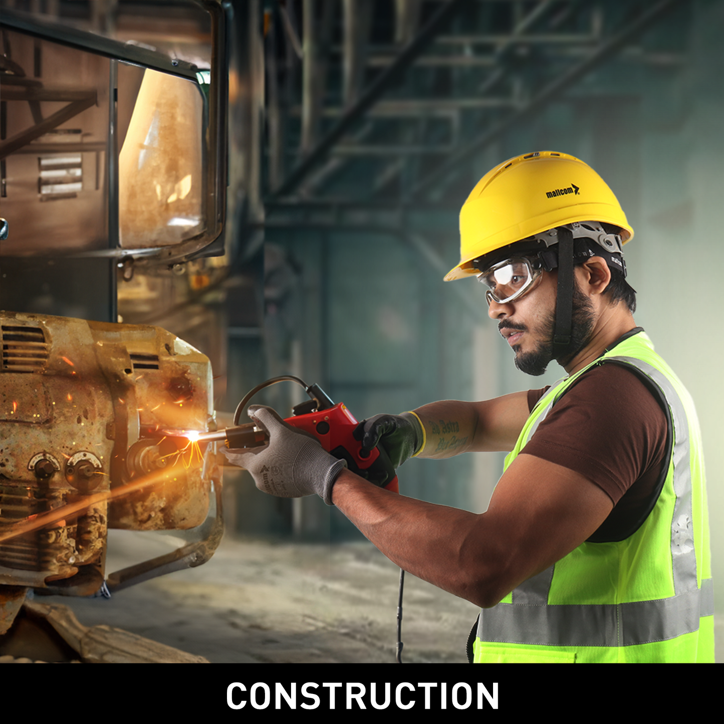 Mallcom safety goggles for construction work and protection against dust and impact hazards.