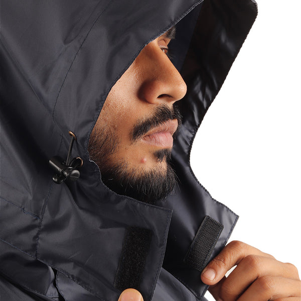 Velcro closure on the ARCUS grey and blue rainwear hood for secure attachment and easy removal.