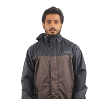 Front view of the ARCUS grey and blue rainwear suit featuring utility pockets, detachable hood, and secure front closure.