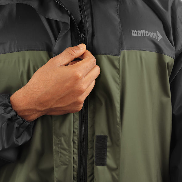 Front zipper closure on the ARCUS olive and black rainwear jacket for secure fastening.