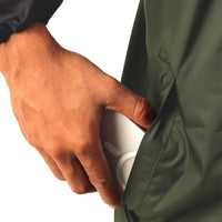 Utility pocket on the ARCUS olive and black rainwear jacket for convenient storage.