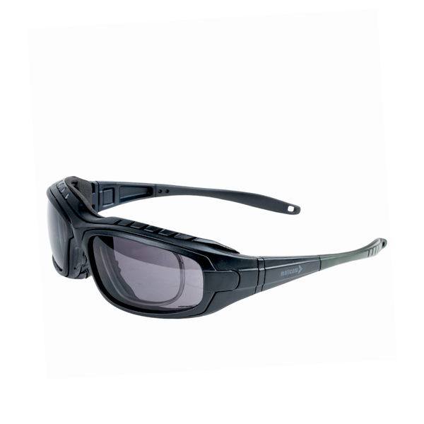 Mallcom Avior safety goggles left-side view with a clear wraparound lens, black frame, and adjustable temples.
