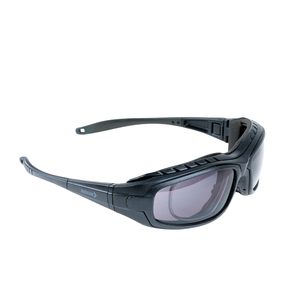 Mallcom Avior safety goggles right-side view with a clear wraparound lens, black frame, and adjustable temples on a white background.
