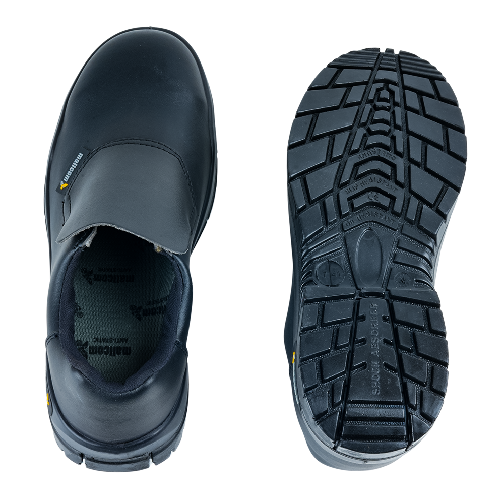 Outsole view of Cymric safety shoes showing the antiskid tread pattern and durable PU sole design.