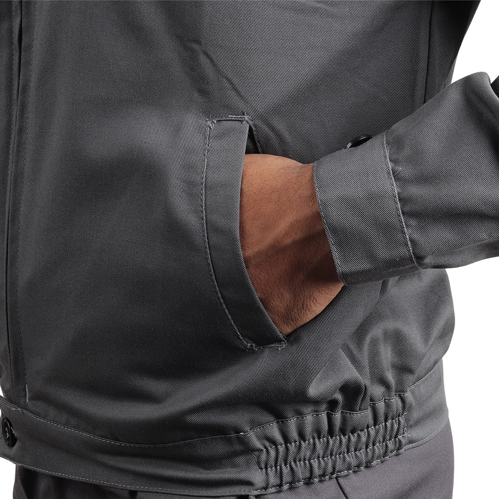 Side pocket on the KOLDING workwear jacket for convenient storage of work essentials.