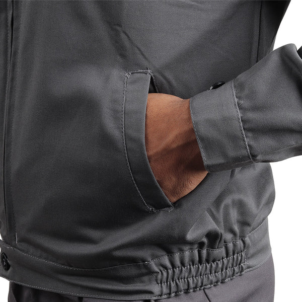 Side pocket on the KOLDING workwear jacket for convenient storage of work essentials.