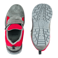 Upper and outsole views of grey and red low ankle steel toe safety shoes.