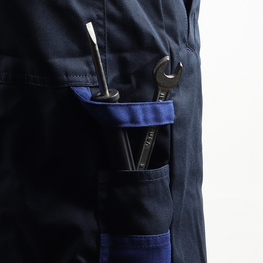 Accessories holder on the Floriad workwear coverall for convenient storage of work essentials.