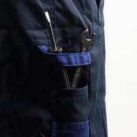 Accessories holder on the Floriad workwear coverall for convenient storage of work essentials.