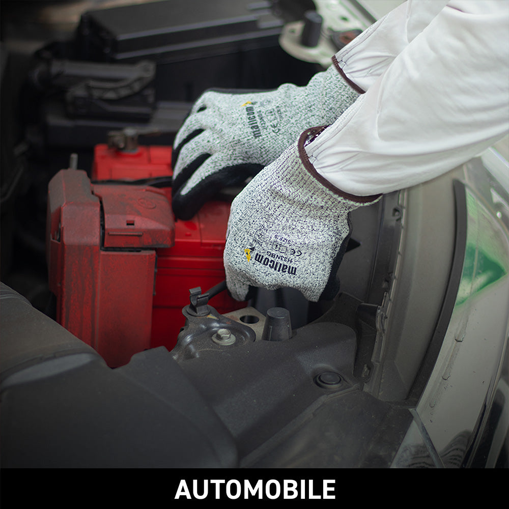 H33NBG safety gloves used in automotive manufacturing and assembly operations requiring precision and protection.
