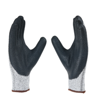 Angled view of H33NBG safety gloves highlighting nitrile coating, grip performance, and cut resistance.