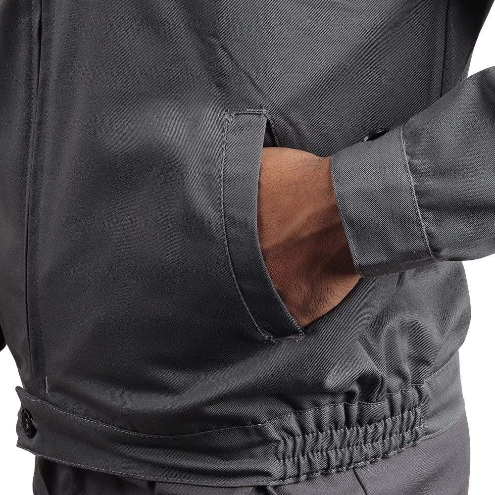 Utility pocket on the KOLDING & NORD workwear suit for convenient storage of tools and work essentials.