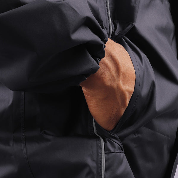 Utility pocket with side opening on the black STRATUS rainwear jacket for convenient storage of essentials.