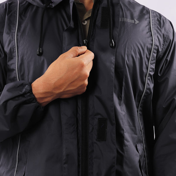 Front zipper closure on the black STRATUS rainwear jacket for secure fastening and easy wear.