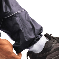 Elasticated ankle cuff on the navy blue STRATUS rainwear pants for a secure and comfortable fit.