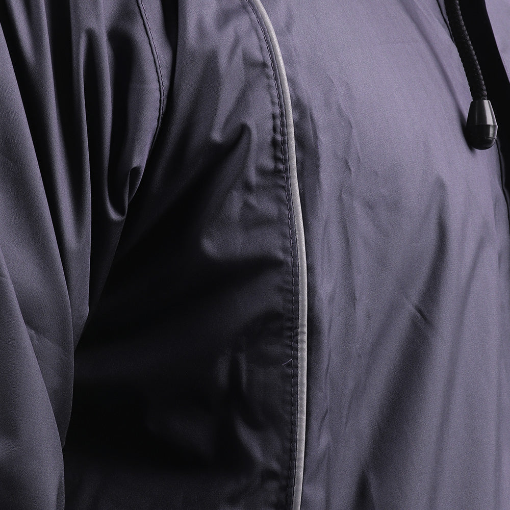 Silver piping detail on the navy blue STRATUS rainwear suit for enhanced visibility and style.