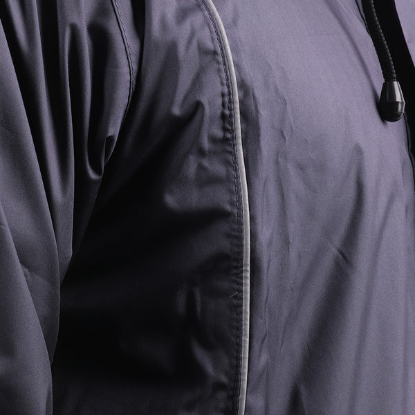 Silver piping detail on the navy blue STRATUS rainwear suit for enhanced visibility and style.