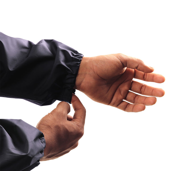 Adjustable wrist cuff on the navy blue STRATUS rainwear jacket for a secure and comfortable fit.