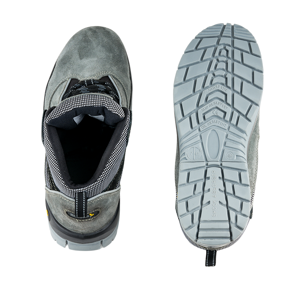 Outsole view of Manxsuede safety shoes showing slip-resistant tread pattern and durable dual-density PU sole.