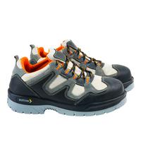 Pair of Margay low ankle safety shoes with steel toe protection and durable PU sole for industrial use.
