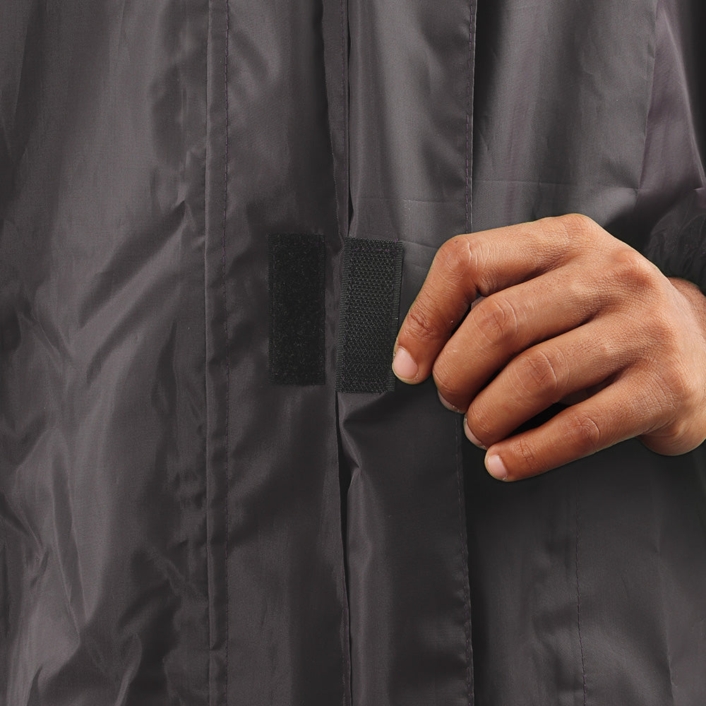 Velcro-secured storm flap on the grey NIMBUS rainwear jacket for added weather protection.