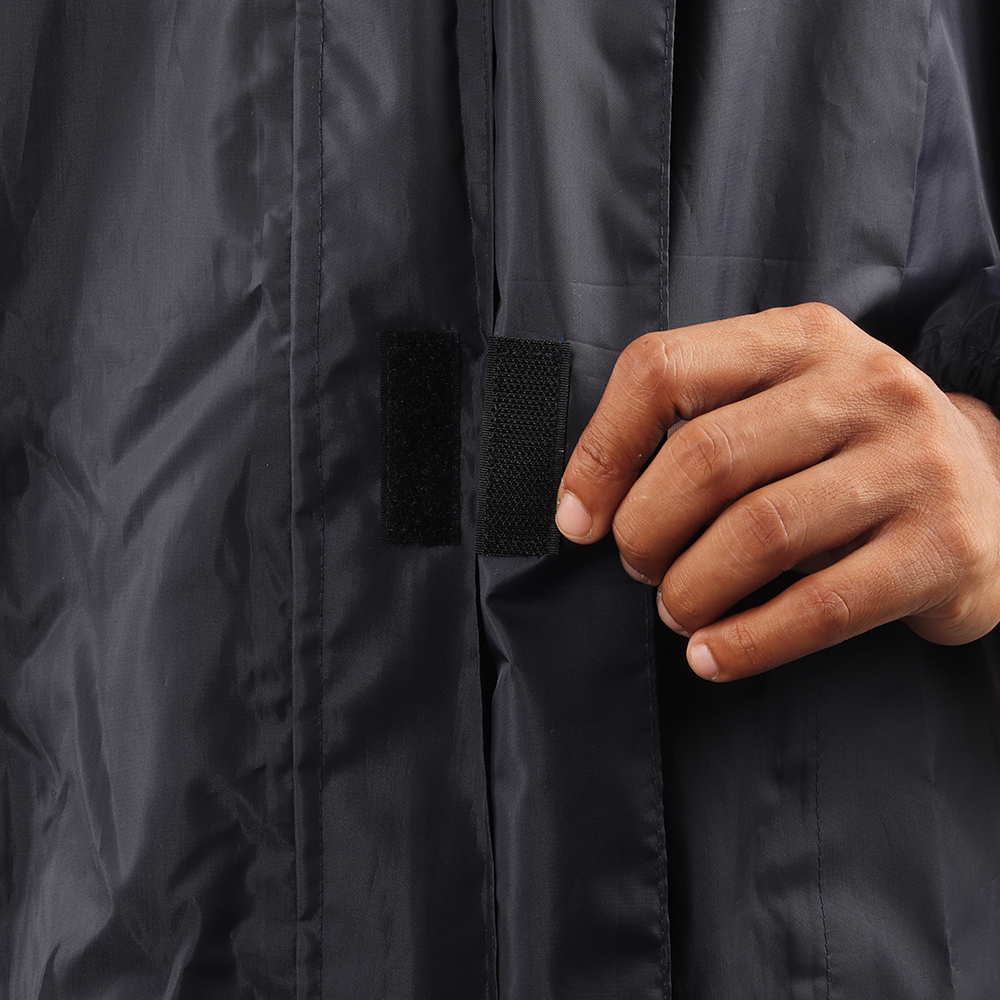 Velcro-secured storm flap on the navy blue NIMBUS rainwear jacket for added weather protection.