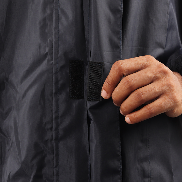 Velcro-secured storm flap on the navy blue NIMBUS rainwear jacket for added weather protection.