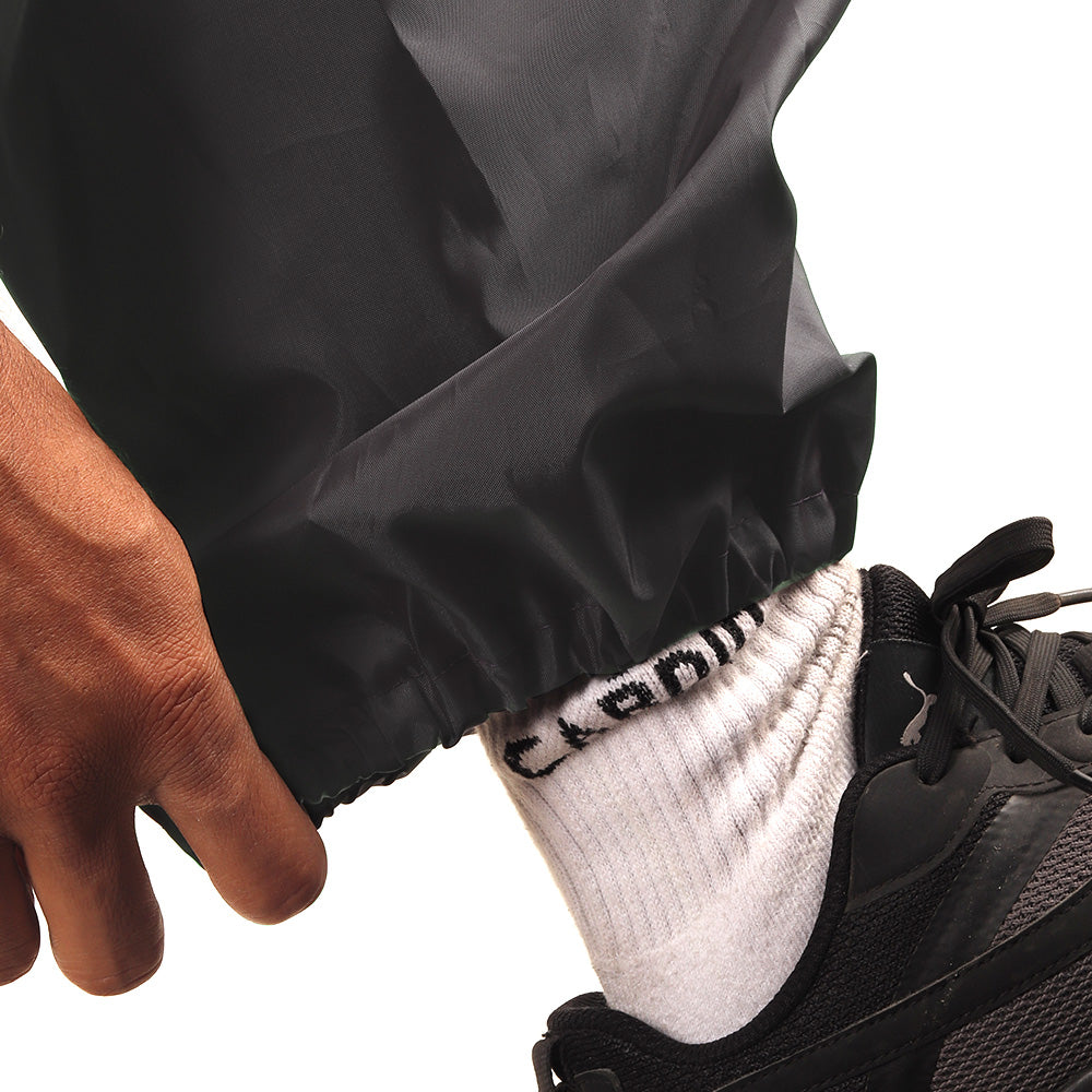Elasticated ankle cuff on the grey NIMBUS rainwear pants for a secure and comfortable fit.