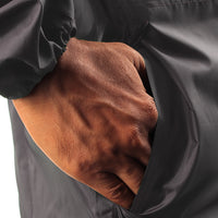 Utility pocket with side opening on the grey NIMBUS rainwear jacket for convenient storage of essentials.