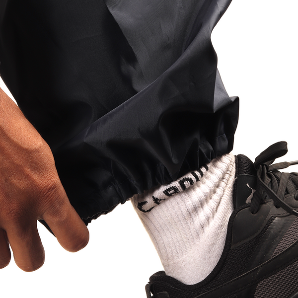 Elasticated ankle cuff on the navy blue NIMBUS rainwear pants for a secure and comfortable fit.
