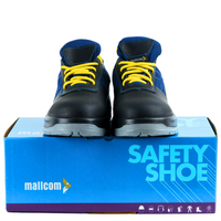 Blue and black steel toe safety shoe displayed on top of its packaging box.