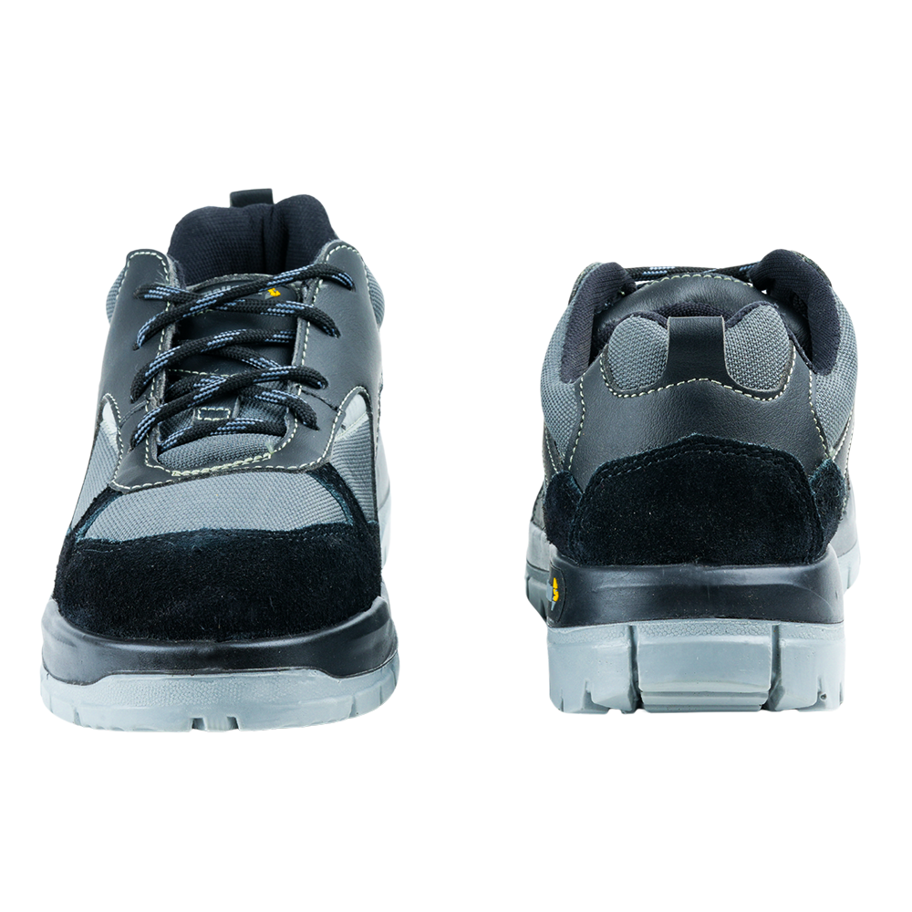 Front and back views of black low ankle safety shoes showing the toe design and heel construction.