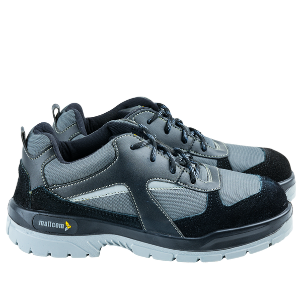 Side view of a black low ankle safety shoe showing the upper design and sole construction.