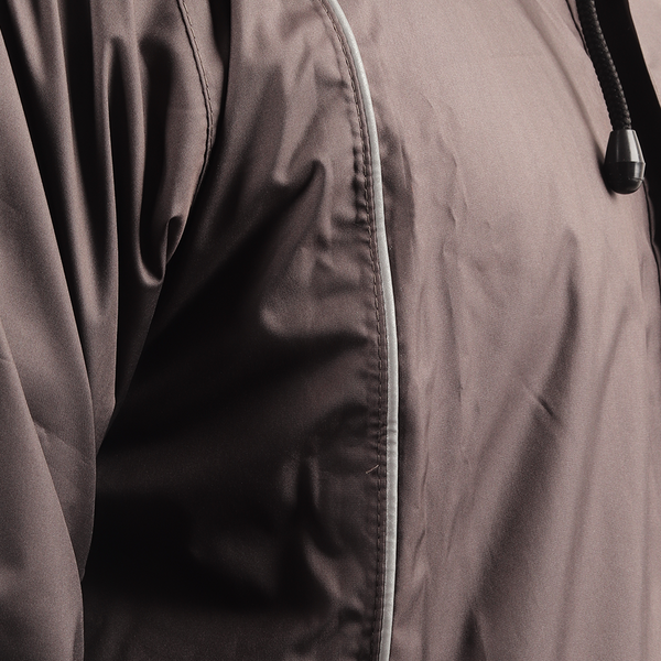 Silver piping detail on the grey STRATUS rainwear suit for enhanced visibility and style.