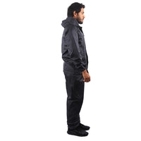 Side view of the navy blue STRATUS rainwear suit showcasing waterproof construction, reflective detailing, and functional design.